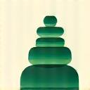 Abstract depiction of building blocks or dominoes, representing habit stacking.